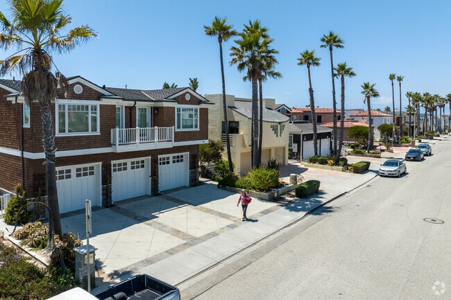 Homes throughout the Oxnard Shores neighborhood feature towering palm trees.