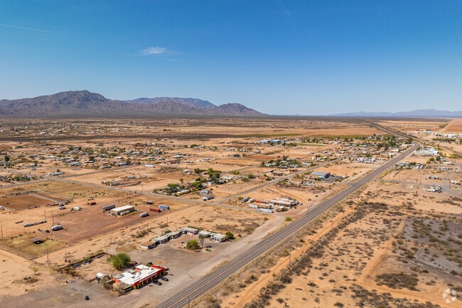 Situated 91 miles northwest of Phoenix, amid cantaloupe fields and saguaro cacti, Aguila is a small community of farmers and cowboys with only one restaurant, a gas station and a library.
