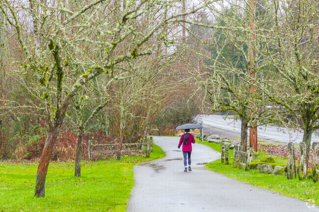 South Hill Community Park offers paved paths and green space near Clover Creek.