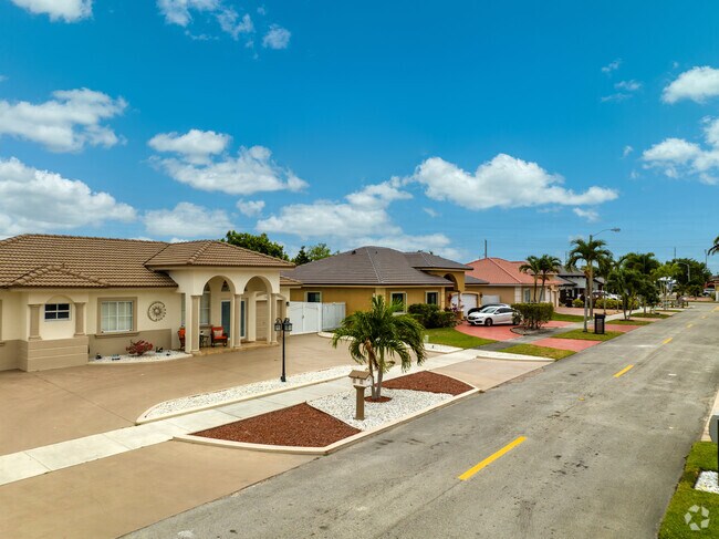 Single-family homes in Miami's Amelia District have well-kept lawns.