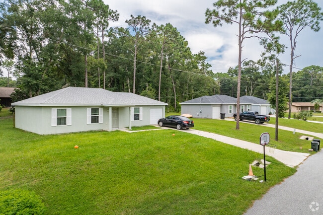 Inverness Highlands South features homes with lush green grass lawns.