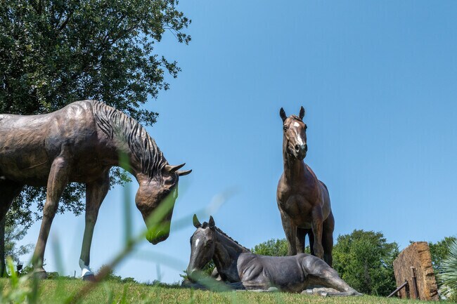 Statues of horses resting in Bartonville.