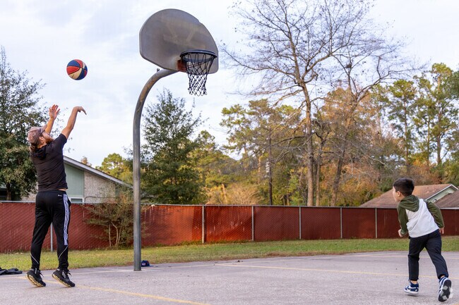 A father and his son play a game of basketball at Campbell Park in Cleveland.
