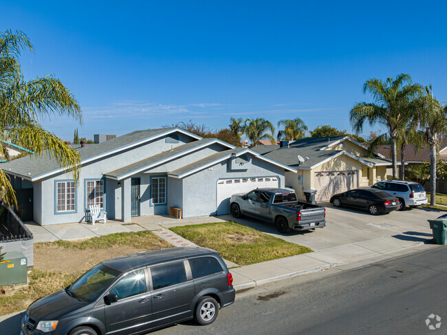 Many of the mid 20th century homes in West Delano enjoy landscaping with palm trees.