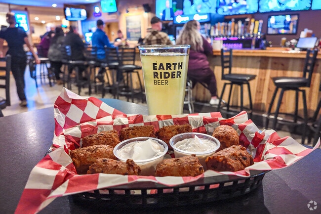 Woodland residents visit The Other Place Bar & Grill for sports and summer volleyball.