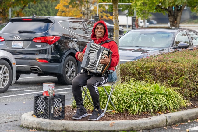 An accordion tune drifts through the air near West Lake Sammamish, creating a festive vibe.