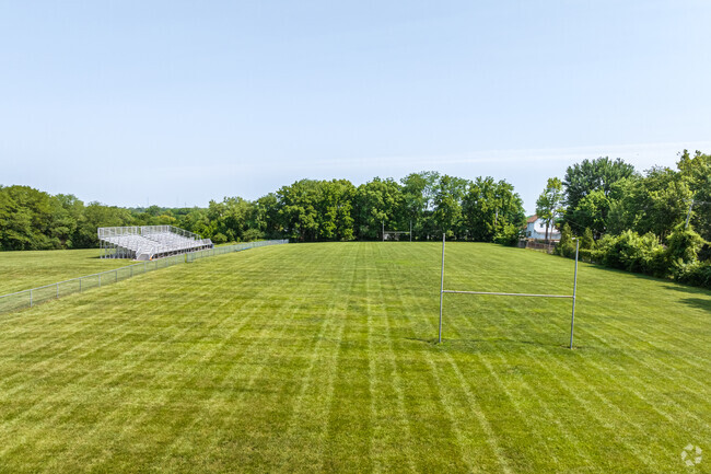 Grandview Middle School has a football field that is green and well kept.