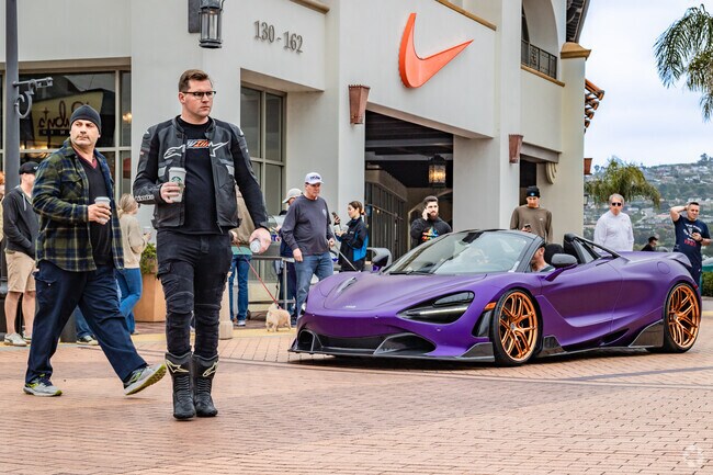 San Clemente Outlets hosts the South OC Cars and Coffee over their parking structure.