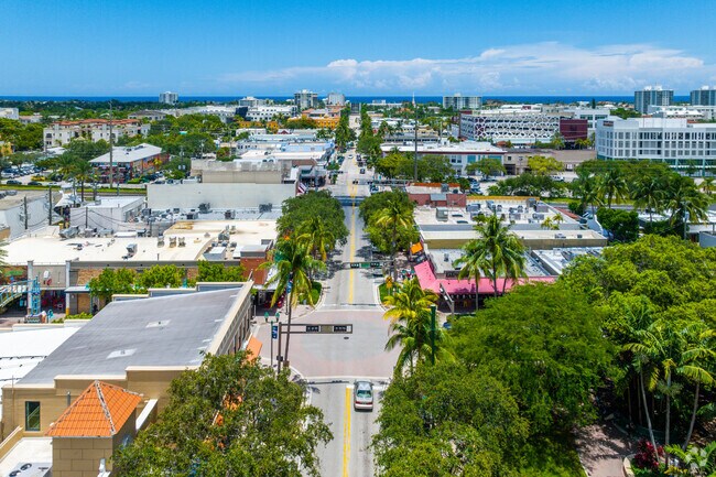 Aerial over Atlantic Ave in Downtown Delray Beach ending down by Ocean Blvd..