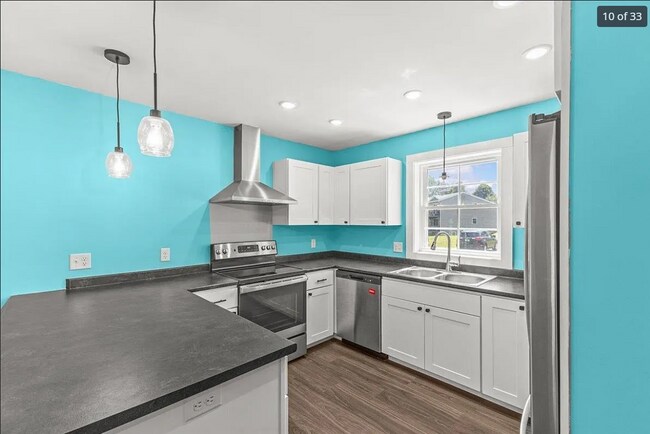 Bright kitchen w/stainless steel appliances. Imagine yourself having breakfast at the island :)