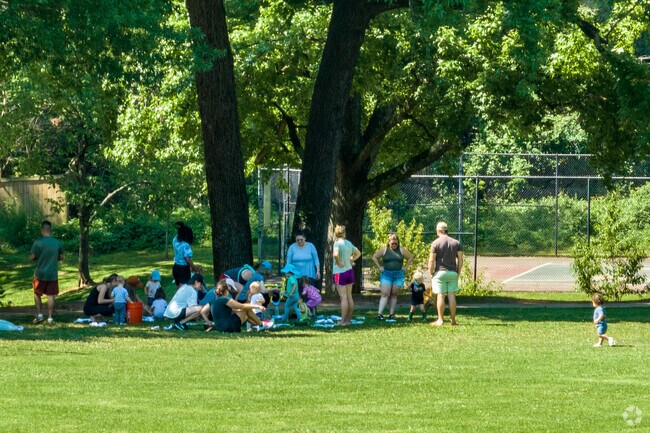 Neighbors play with the children at Midwood Park in Plaza Midwood.