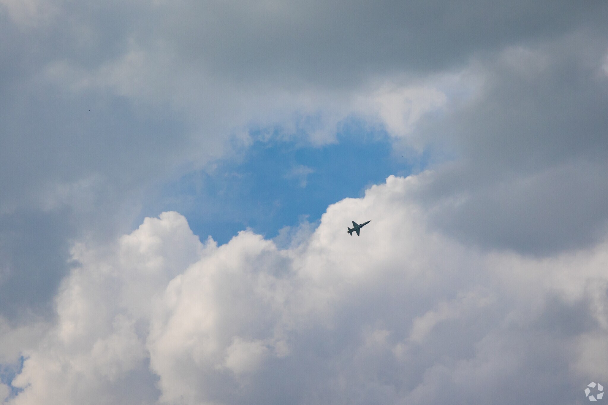 A fighter jet taking off from nearby Randolph AFB.