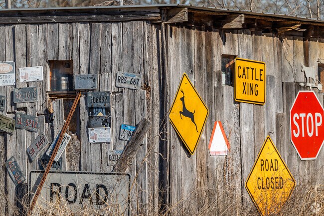 An old barn in Rockvale is adorned with road signs.