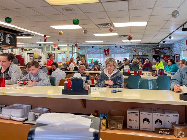 Diners sitting at the counters at the Original Hot Dog Shoppe in the Amvets neighborhood.