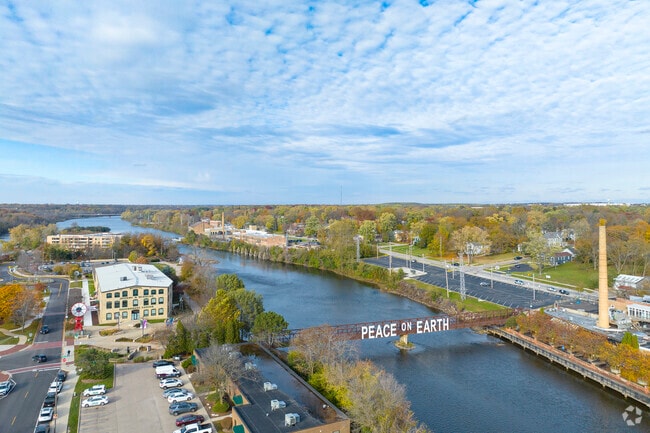 The Peace on Earth letters shine over the Fox River in Southeast Batavia.