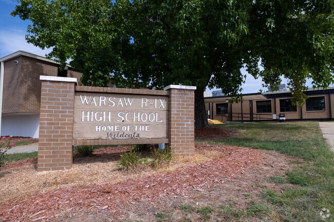 Warsaw High School sign marks the campus entrance.