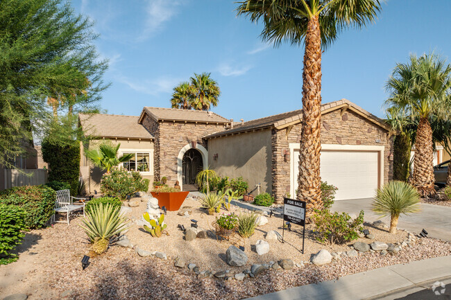 A Mediterranean-contemporary home with draught-friendly landscaping is seen in Mountain Gate.