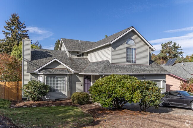Some West Portland Park yards are accented by eclectic arrangements of shrubs and flowers.