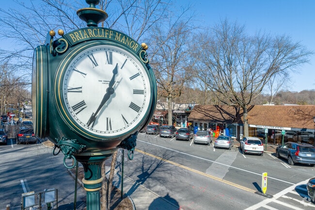 A clock on Pleasantville Road welcomes visitors to Briarcliff Manor.
