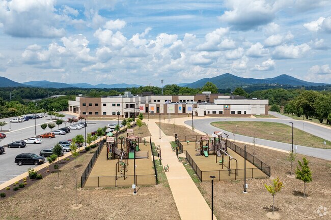 Fallon Park Elementary School has a playground for the kids on the front grounds.