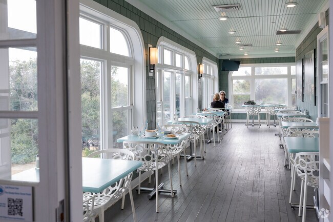 Guests enjoy a relaxed lunch on Graze’s enclosed veranda in N Virginia Beach.