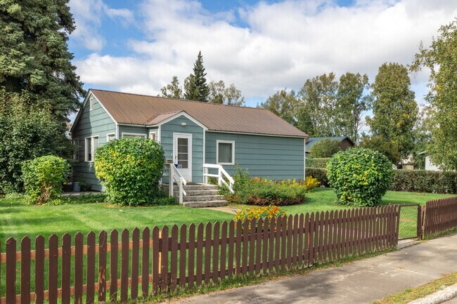 Find modest homes with green lawns in Weeks Field.