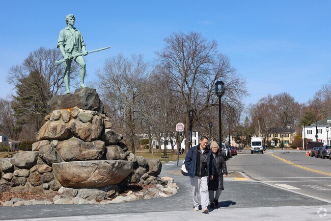 John Parker, stands on the Battle Green in nearby Lexington greeting the Shakerhill visitors.