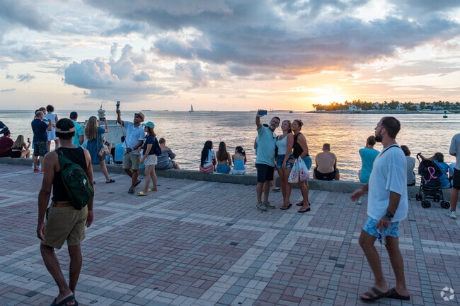 People from Old Town enjoy gathering to watch the sunset at Mallory Square.