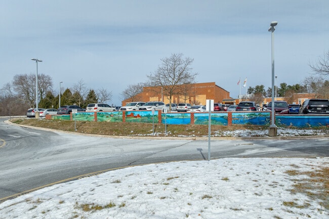There is a painted wall at the entrance of Tracey's Elementary School building.