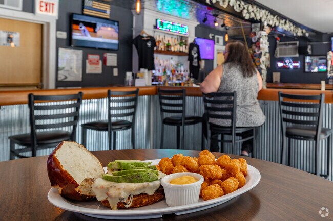 Bad Altitude Bar and Grill in Forest View offers a full menu including sandwiches, wings and pizza.