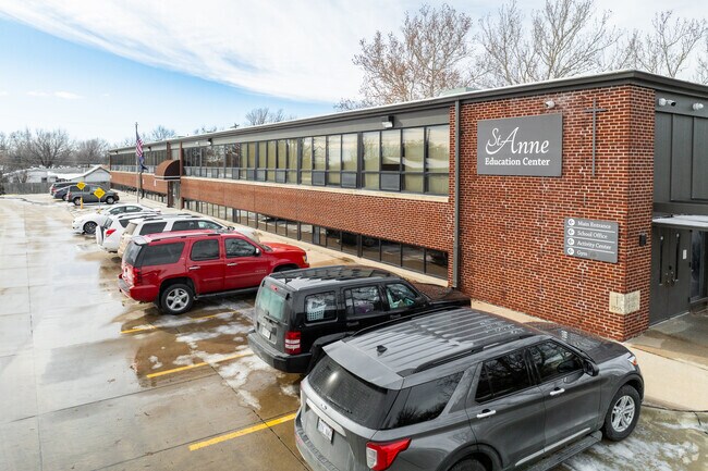 The building for St Anne Elementary School is made of red brick.