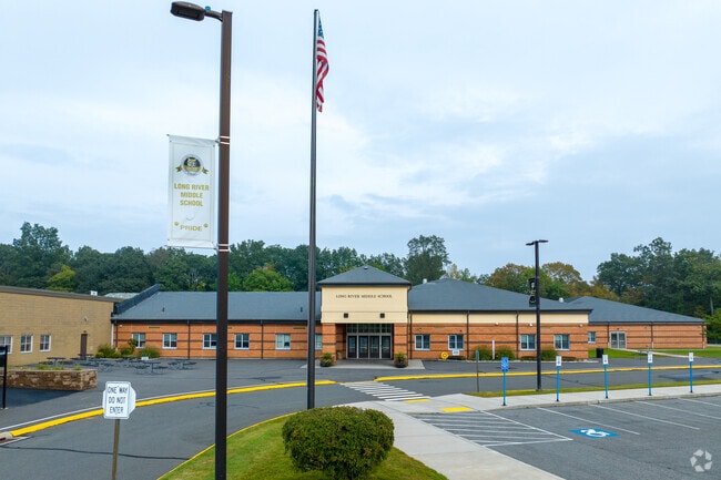 Long River Middle School has a parking lot in the front nearby the entrance in Prospect, CT.