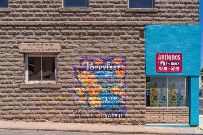 A colorful mural marks the entrance to a local antique shop, showcasing the town’s appreciation for art, history, and small business charm.