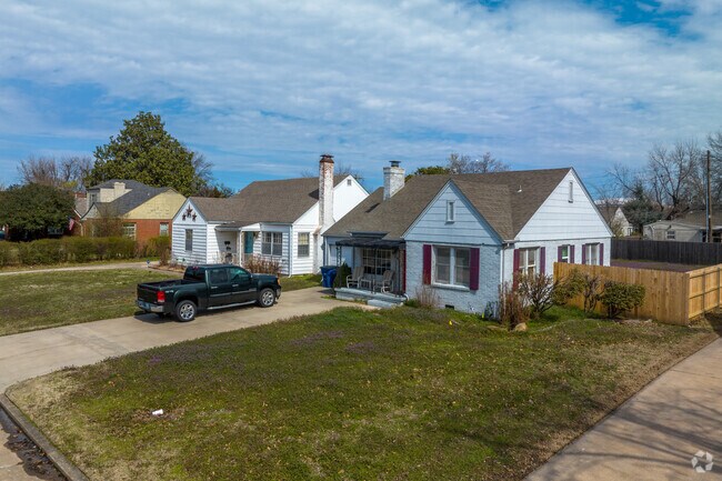 Here in Sunrise Terrace is a single-family home with a wooden fence surrounding it.