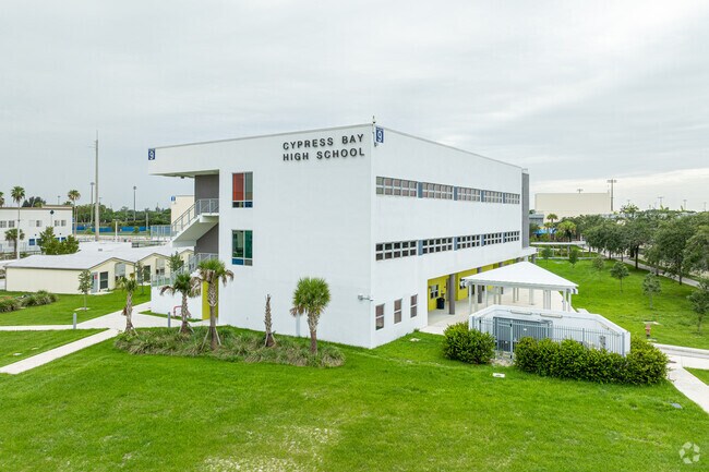 The Cypress Bay High School is a couple minutes West of Emerald Estates.