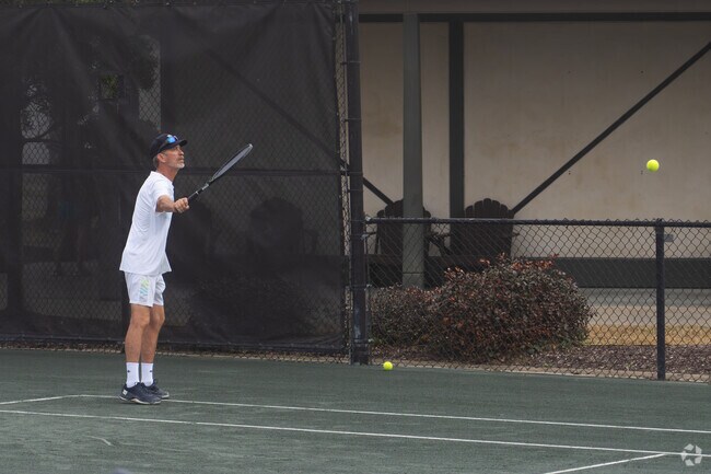 A resident of Lafayette plays a round of tennis at the Oakbourne Country Club.