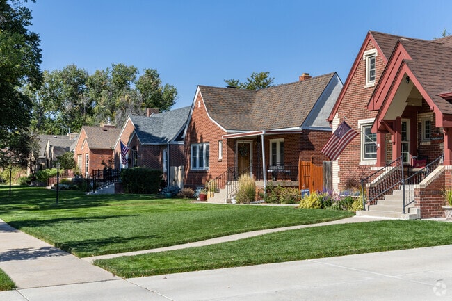 Moore Haven Heights paved sidewalks are covered by large shady trees.