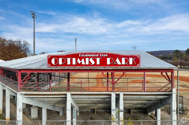 Optimist Park features spectator stands around the baseball field.