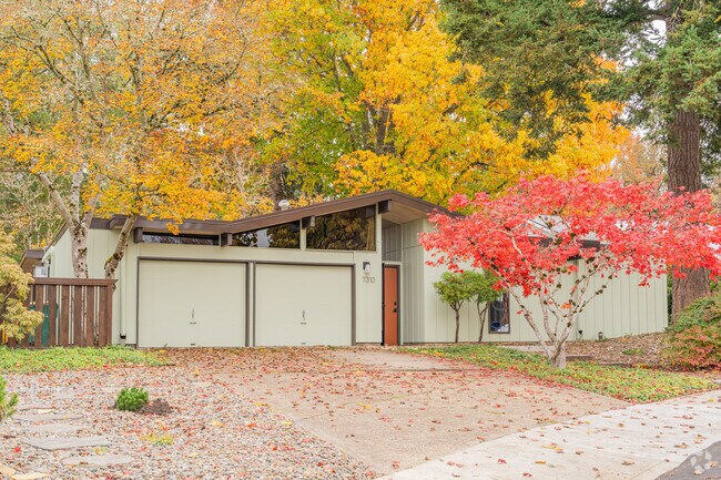 Dense trees and classic architecture offer privacy and character in this Garden Home-Whitford suburb.