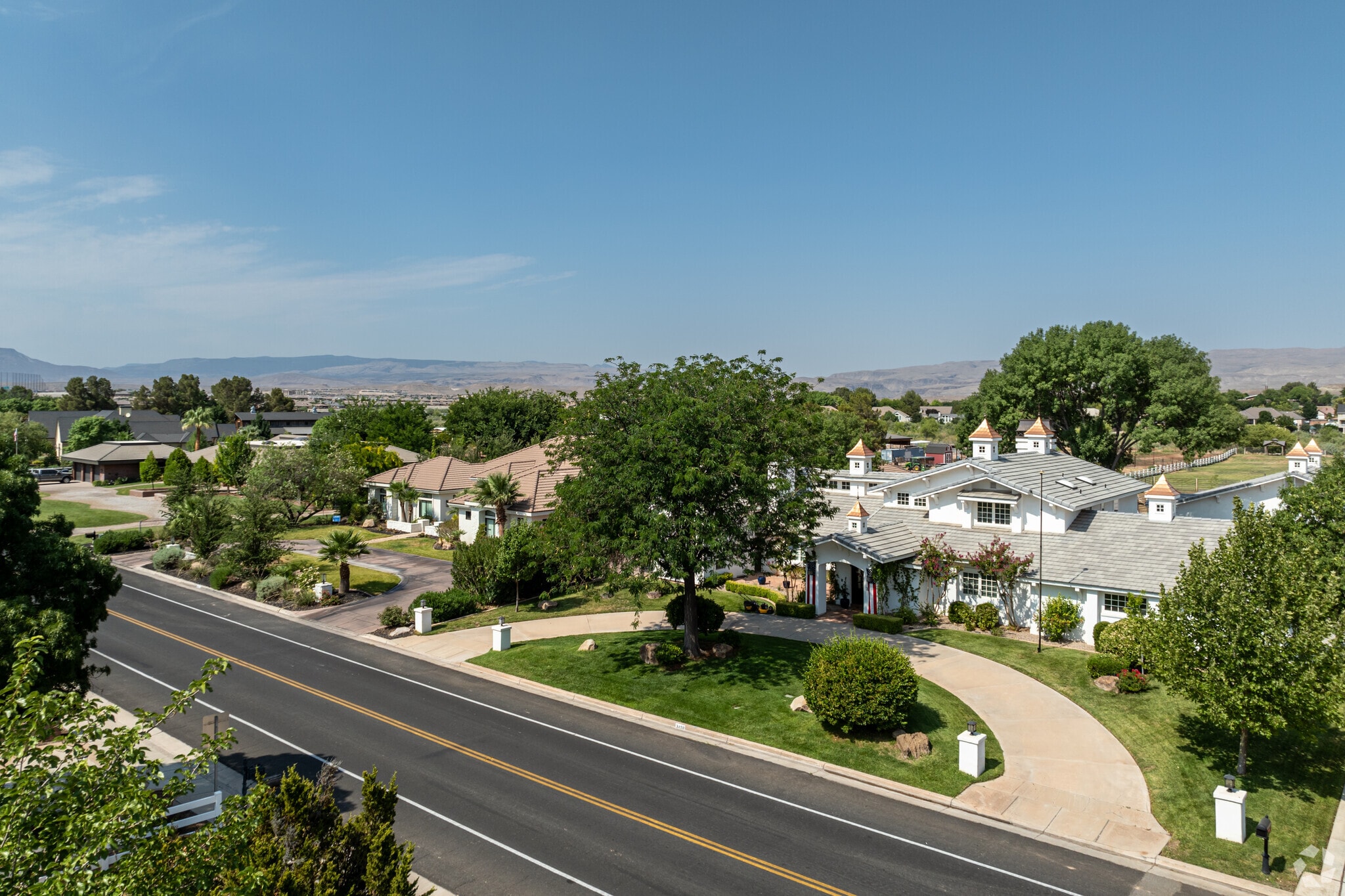 Homes with moderately sized yards feature year-round grass.
