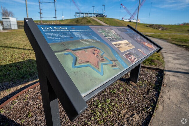An informative kiosk adorns the sidewalk near Darrow.