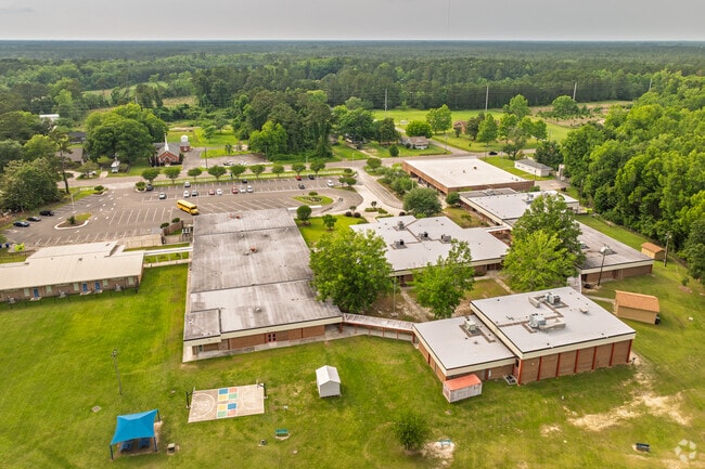 Bolivia Elementary School features a large campus with ample play areas and open space.