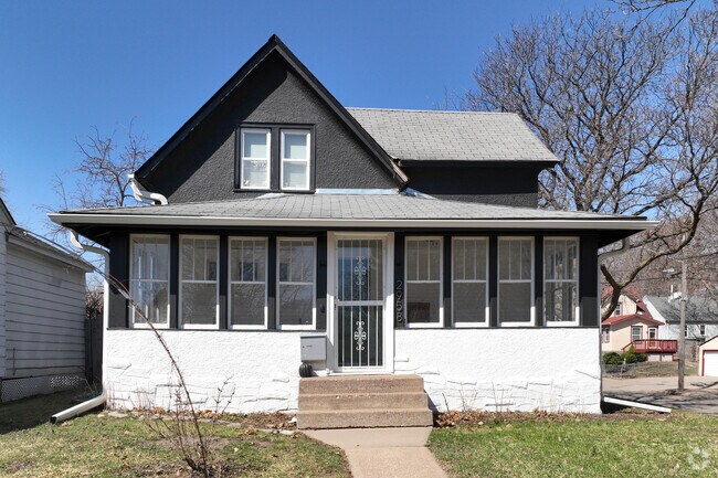A classic two-story home with enclosed porch in the Folwell neighborhood.