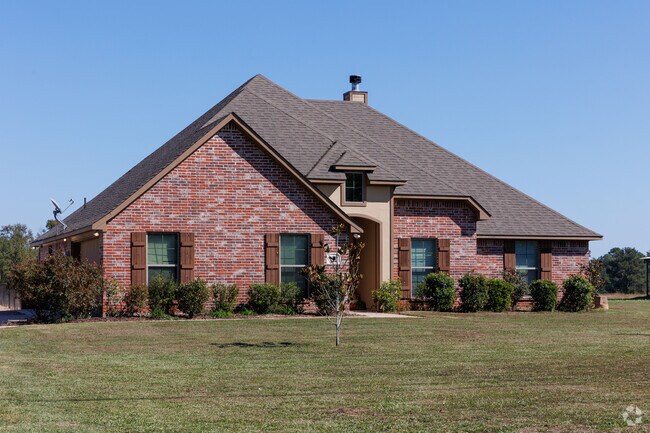 Brick home on a large plot in Frierson.