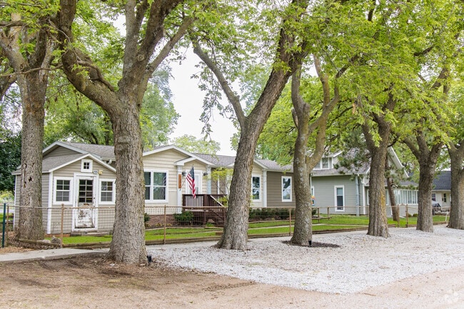 Mature trees line the streets and provide shade for homes in Walton.