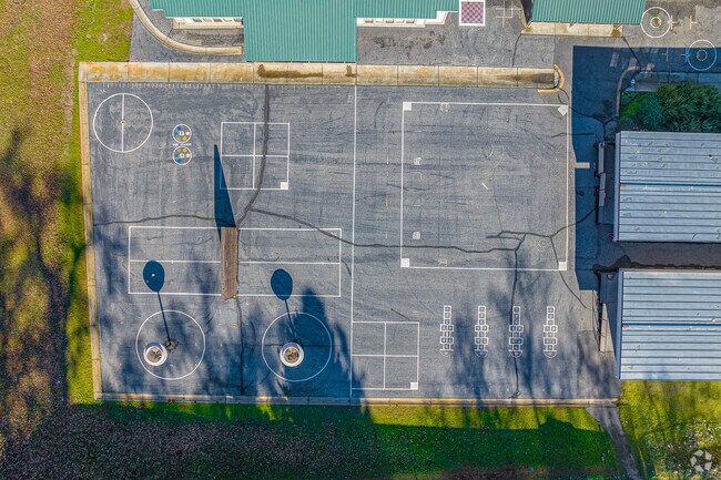 Asphalt play area provides students with a place for physical education games.