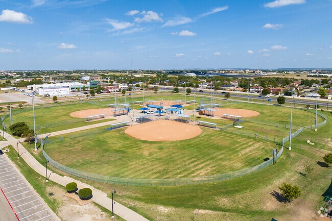 Enjoy a game of basketball or soccer at Lions Club Park's well-kept sports areas.