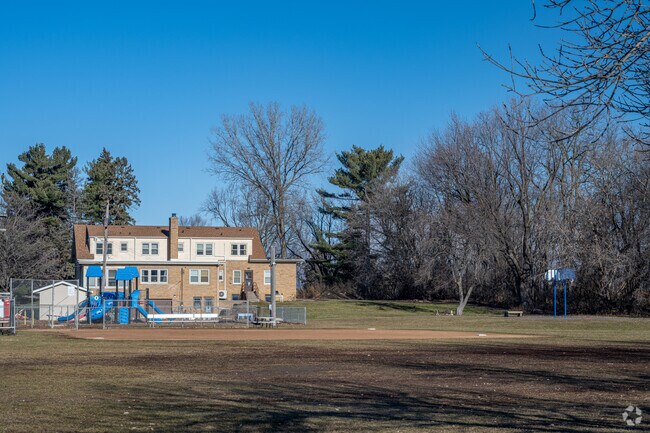 Community of Saints Regional Catholic School has a green space, playground, and basketball.