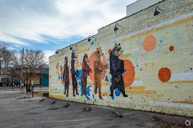 A parade of bears is painted on this colorful mural in Five Points.
