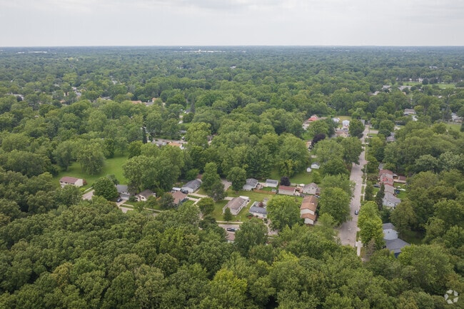 An aerial overview of the wooded residential streets of Wexford Heights.